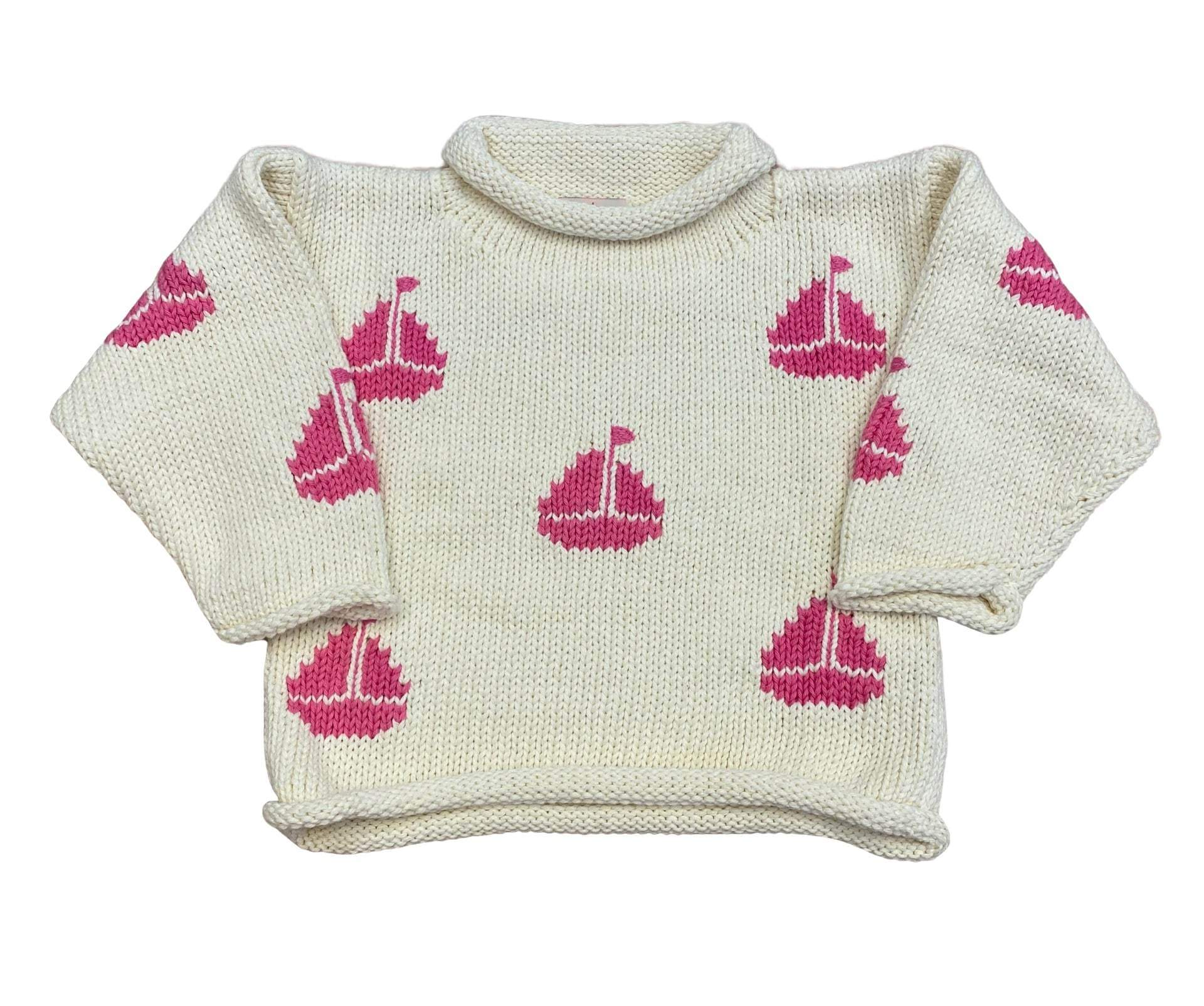 ivory roll neck sweater with pink sailboats knitted all over