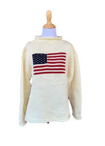 long sleeve ivory roll neck sweater with flag with red stripes and blue square with white stars in center of sweater