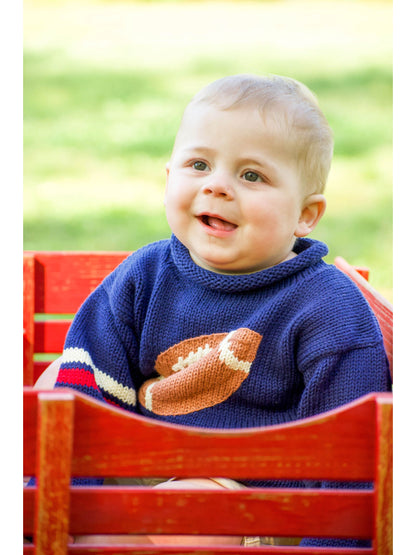 baby in wagon wearing navy football sweater