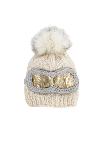 cream hat with gold and grey goggles