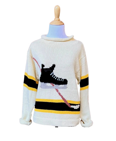 ivory sweater with black hockey skate and yellow/black stripe details