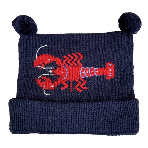 matching Navy Lobster Knit Hat with red lobster horizontal in center with two navy poms on top and bottom of hat rolled once