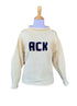 long sleeve ivory sweater with ACK written in navy 