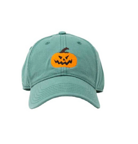 green hat with orange jack-o-lantern pumpkin
