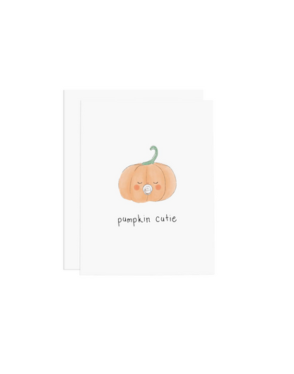 white card with orange pumpkin with a pacifier in its mouth