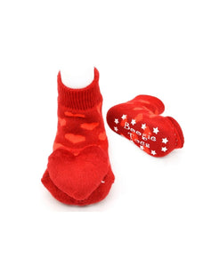 red socks with red hearts all over and large stuffed heart on toe