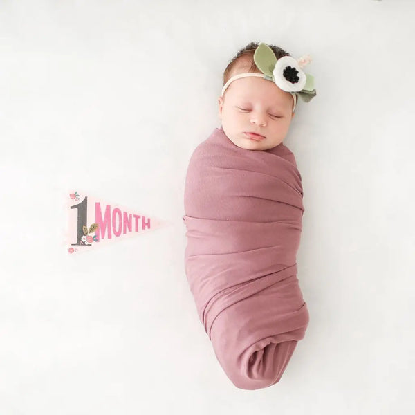 baby with 1 month pennant