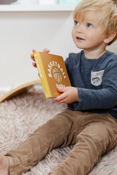 baby holding book