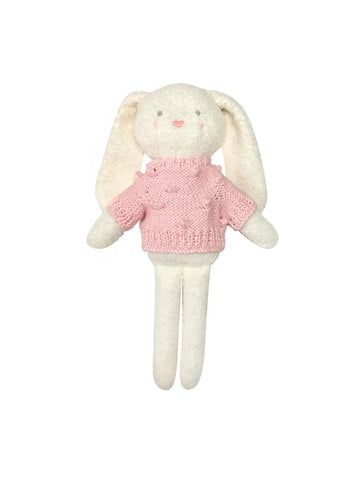 white bunny wearing pink sweater