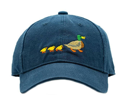 blue baseball cap with green and yellow duck and 3 yellow ducklings following behind