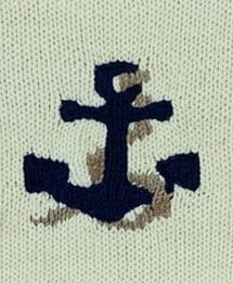 close up of navy anchor with tan rope detail