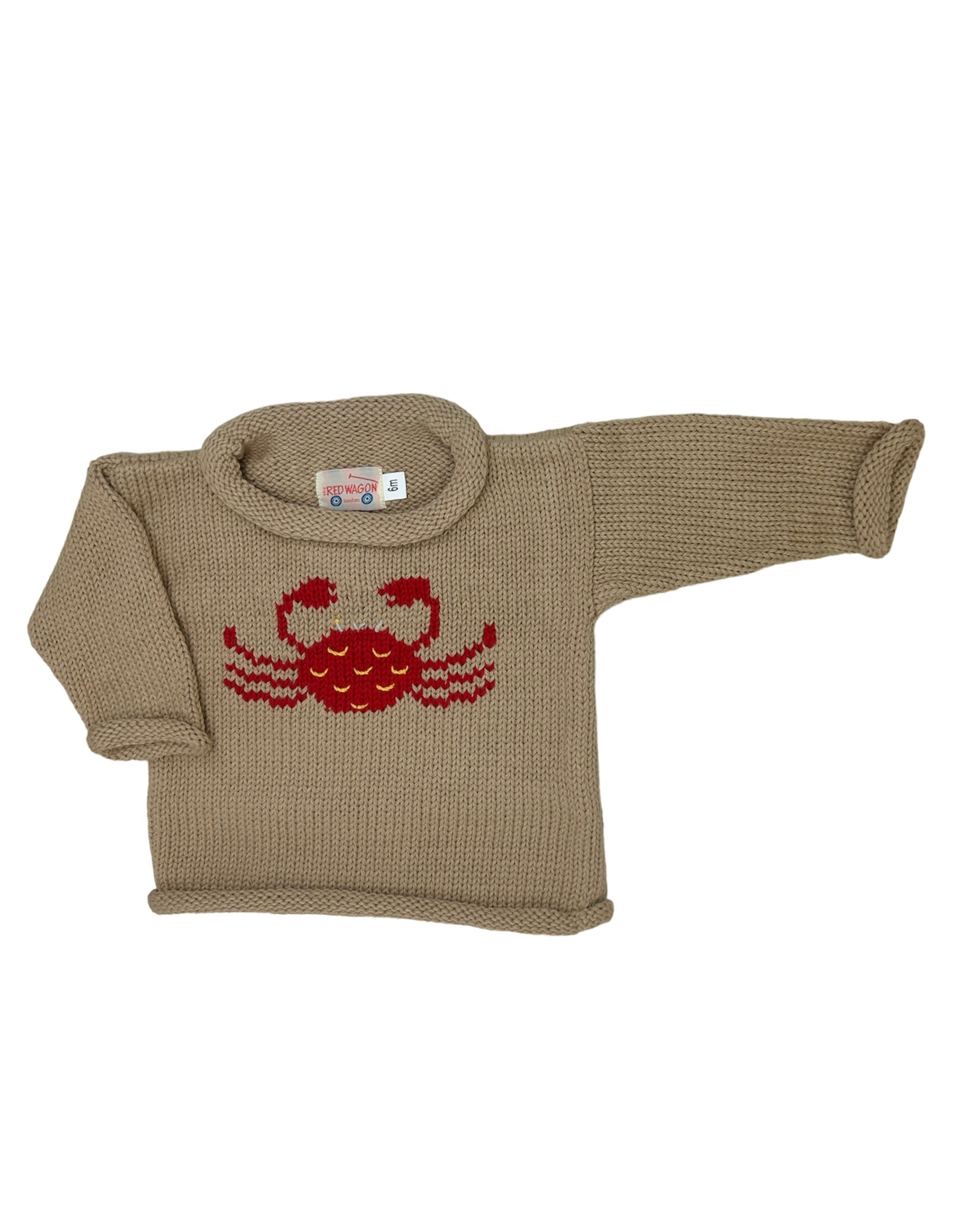 tan long sleeve sweater with red crab
