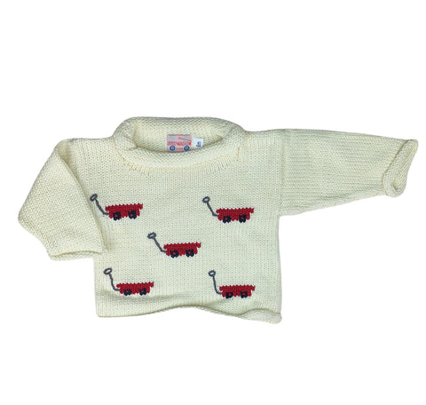 long sleeve ivory sweater with red wagons on front