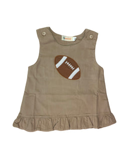 tan jumper dress with brown football in center