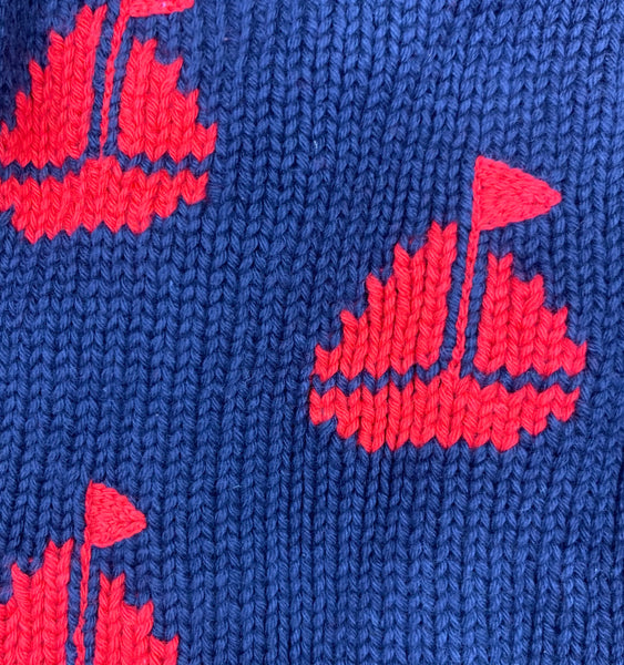close up of red knit sailboats