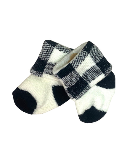 white socks with black on the heel and toe, black and white checked on ankle