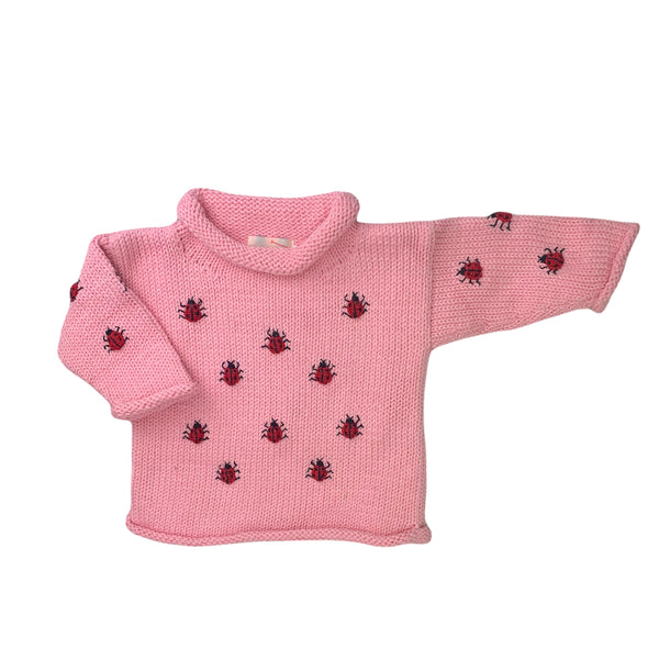 long sleeve pink sweater with red ladybugs all over