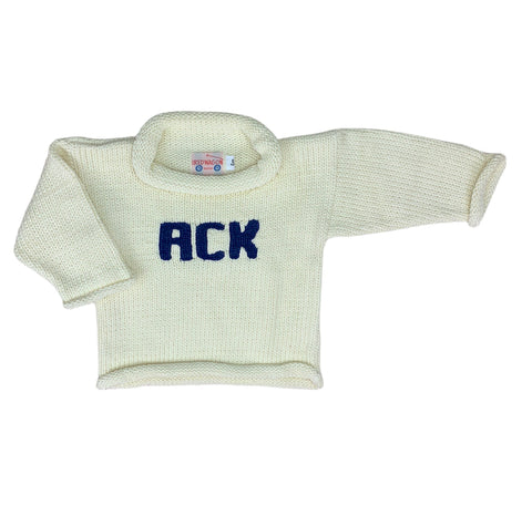 long sleeve ivory sweater with ACK written in darker blue in center