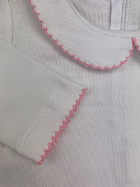 close up of pink scalloped trim