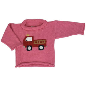 pink roll neck sweater with red firetruck knitted on front, firetruck has tan ladder and yellow siren on top