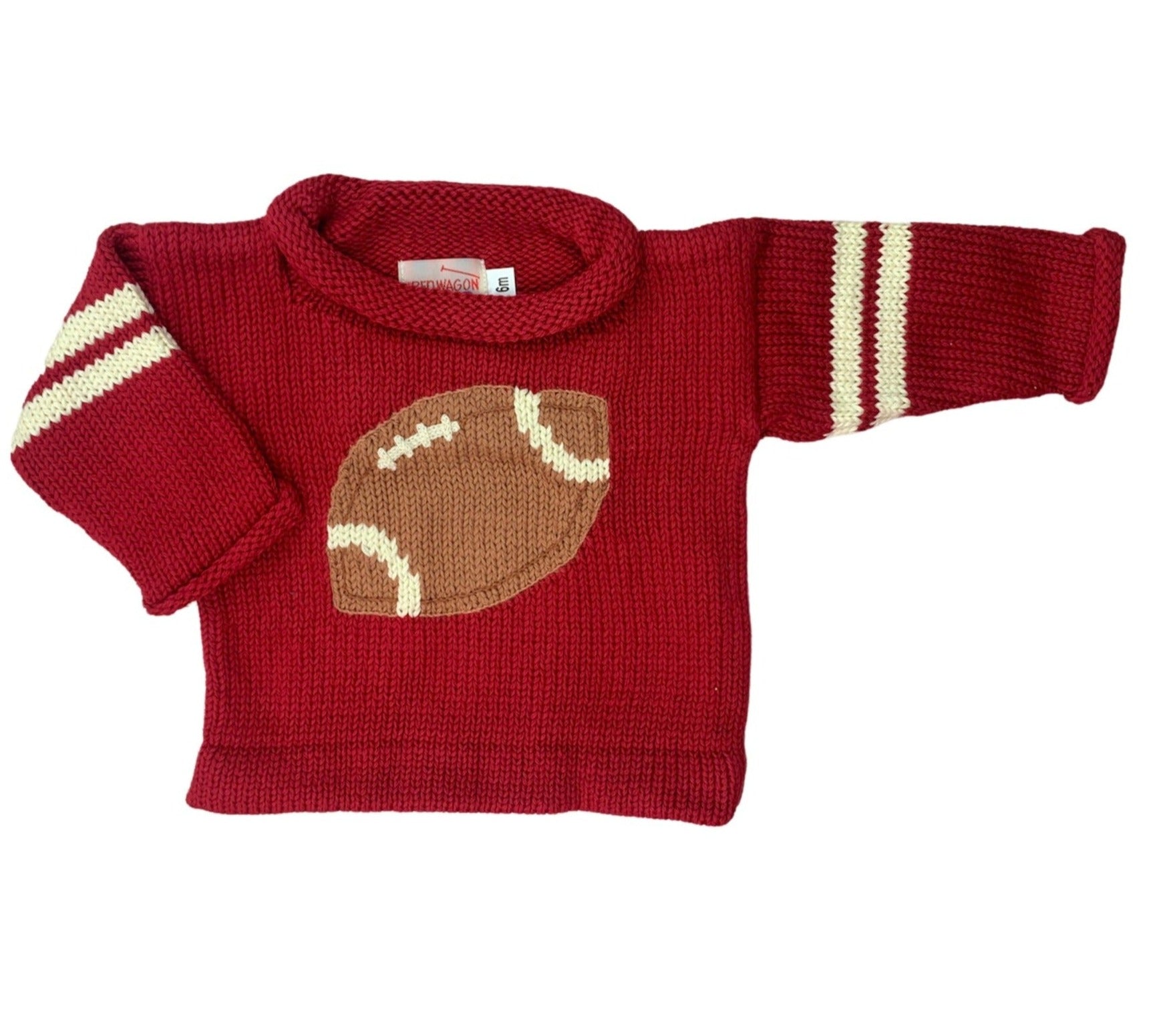 red sweater with 2 ivory stripes on each sleeve and brown football in the center