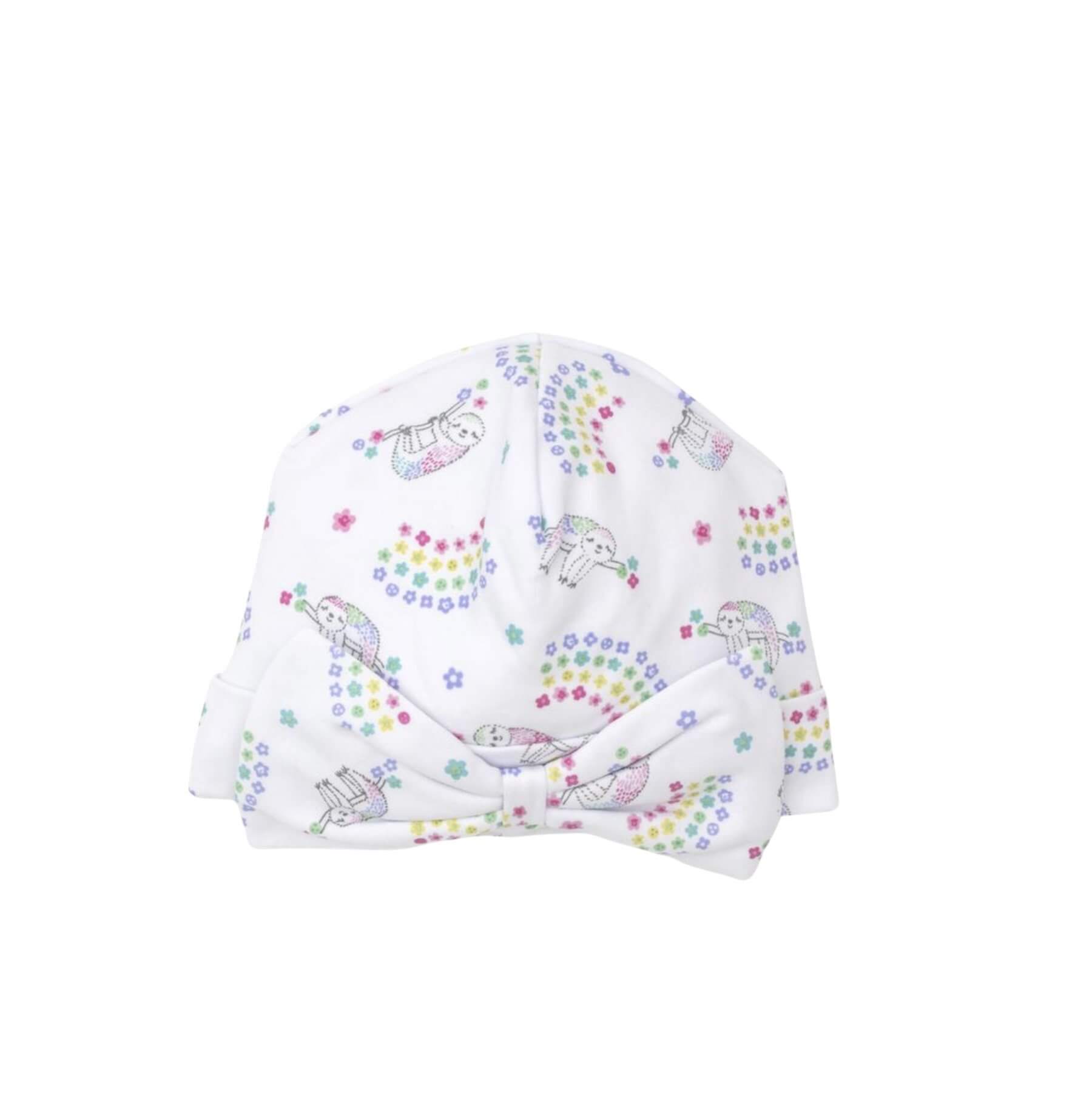 white hat with tiny star rainbows and sloth details and bow on front
