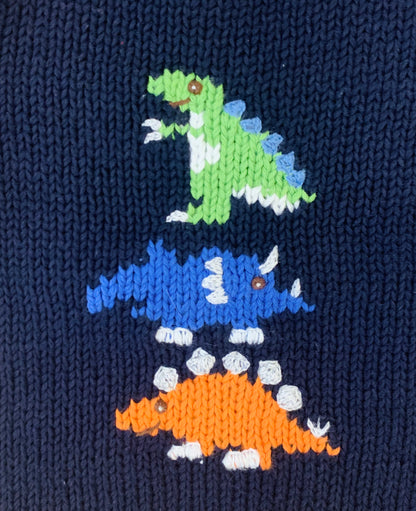 close up of green, blue and orange dinosaurs