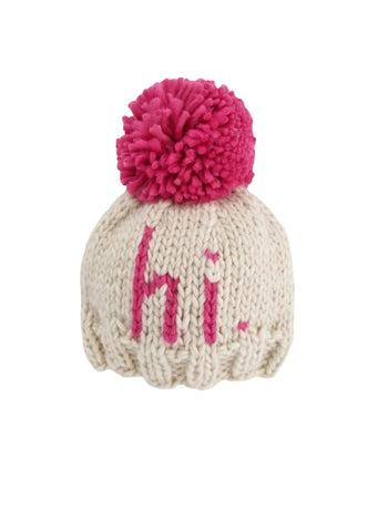 ivory beanie with neon pink "hi" and pink pom at top