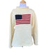long sleeve ivory roll neck sweater with flag with red stripes and blue square with white stars in center of sweater