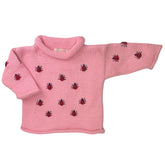 long sleeve pink sweater with red ladybugs all over