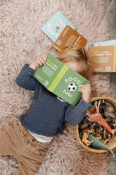 kid reading soccer book