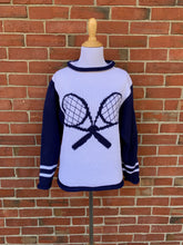picture of sweater in front of a brick wall
